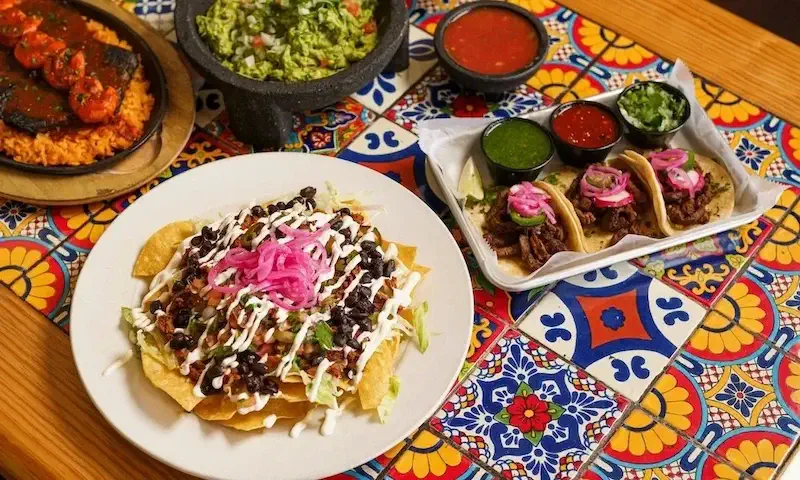 carne asada tacos and assorted toppings