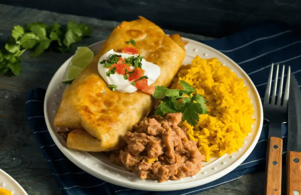 Chimichanga dish with rice and beans