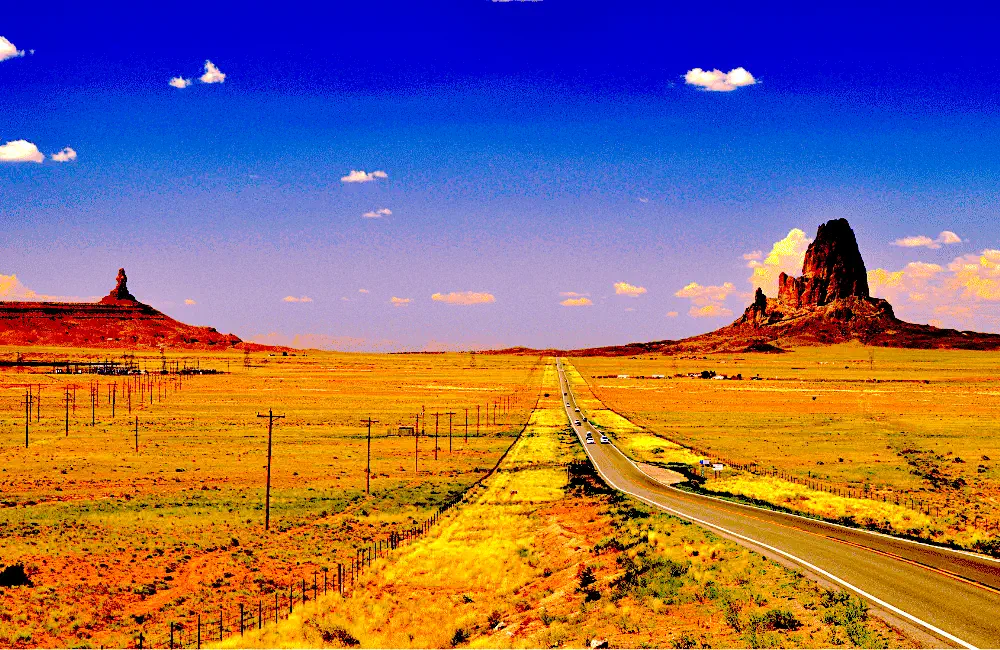 scenic road stretching through Monument Valley